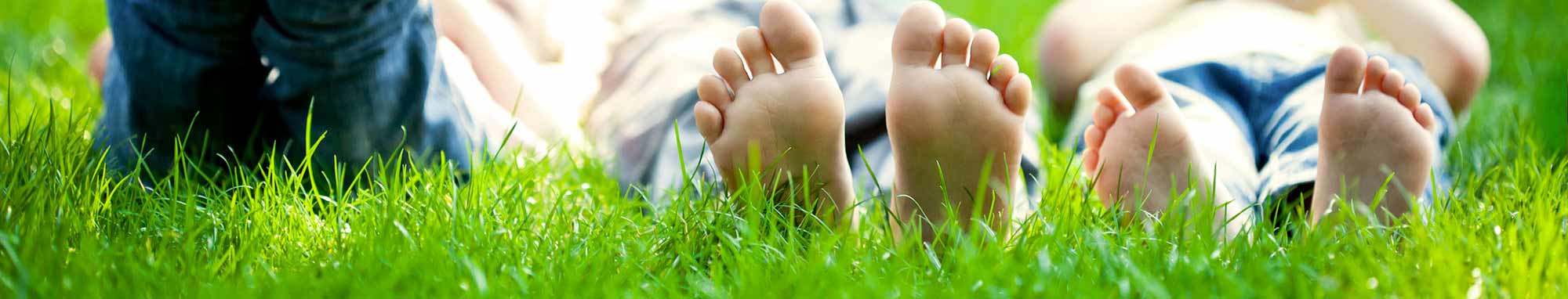 feet-on-grass – Choice Floors Artificial Grass